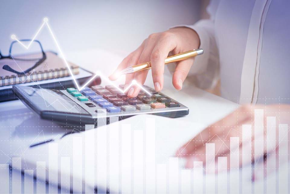 accountant-calculating-profit-with-financial-analysis-graphs