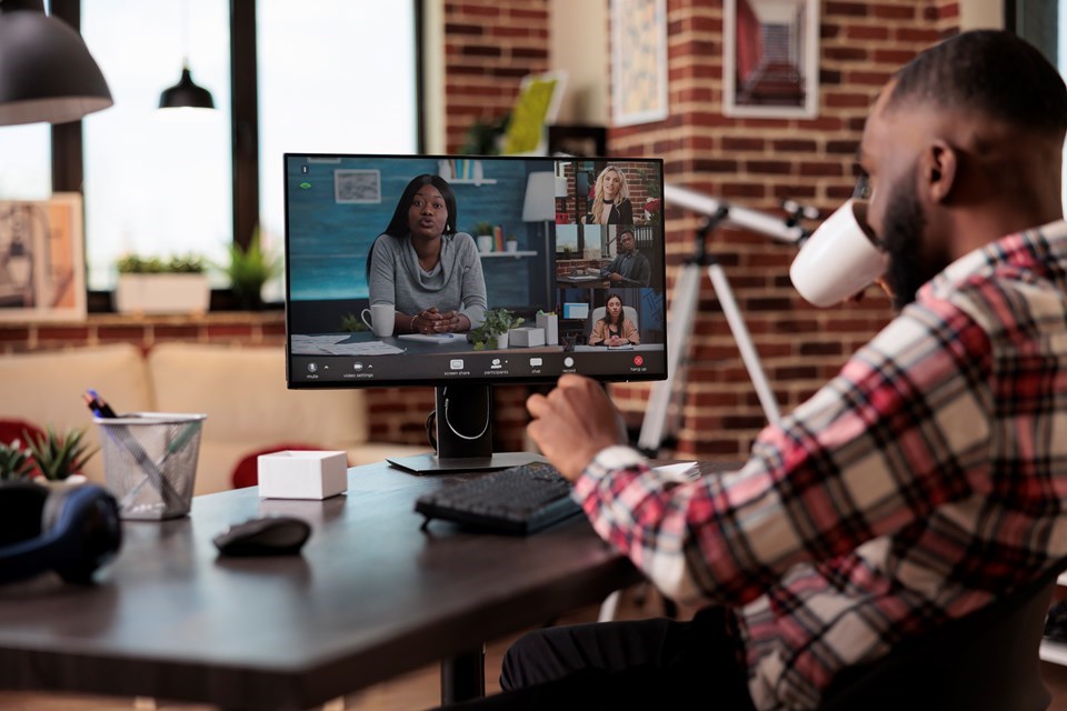 young-man-attending-business-videocall-meeting-with-people-using-computer-webcam-home-working-remotely-online-teleconference-call-talking-remote-videoconference-chat